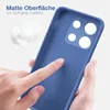 A hand is touching the back of a blue phone case, highlighting its matte texture. There are also some fluffy white objects in the background. Produktbild-Vorschau