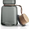 A single storage jar with a lid and a leather strap, shown against a white background. Voir les images du produit