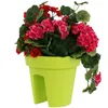 A lime green balcony planter filled with red and pink geraniums. Produktbild-Vorschau
