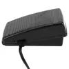 A black foot pedal for a sewing machine, shown from the side with a black cord. Náhľad obrázku produktu