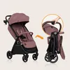 A stroller shown in its open and folded states, with a hand demonstrating the folding mechanism. Produktbild-Vorschau