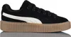 A single black Puma Creeper Phatty shoe with a white stripe and a brown platform sole, shown from the side against a white background. Anteprima dell’immagine prodotto
