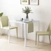 A small white dining table with two light green chairs. Anteprima dell’immagine prodotto
