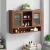 A wooden wall-mounted cabinet with sliding glass doors, filled with various bottles and containers, is displayed against a white wall. Produktbild-Vorschau