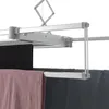 A close-up view of a ceiling-mounted automatic clothes drying rack with clothes hanging on it. Produktbild-Vorschau