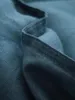 A close-up view of blue fabric with visible stitching. Produktbild-Vorschau