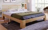 A wooden bed frame with bedding in a bedroom setting. Náhled obrázku produktu
