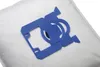 A close-up of a vacuum cleaner bag with a blue plastic adapter. Náhľad obrázku produktu