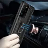 A hand holding a black phone case with a ring holder, which is magnetically attached to a rose gold car mount on an air vent. Produktbild-Vorschau