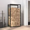 A firewood rack filled with logs, next to fireplace tools, in a room with a white wall and wooden floor. Náhled obrázku produktu