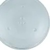 A close-up, top-down view of a glass microwave turntable plate. Produktbild-Vorschau