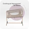 A baby bassinet is shown tilted to demonstrate its adjustable incline feature. Anteprima dell’immagine prodotto