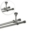 A close-up view of a double curtain rod system mounted to a ceiling. Anteprima dell’immagine prodotto