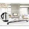 A kettle and a power strip are placed on a kitchen counter in front of a modern fireplace. Produktbild-Vorschau