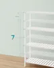 A white slatted shelf unit is shown against a light green wall with a wooden floor. Produktbild-Vorschau