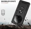 A black rugged phone case with a ring holder is shown in a dynamic, action-oriented scene with debris flying around, suggesting durability and protection. Produktbild-Vorschau