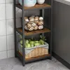 A close-up view of a multi-tiered shelf unit in a kitchen setting, displaying eggs and apples. Náhled obrázku produktu