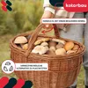 A person is holding a basket full of mushrooms. Anteprima dell’immagine prodotto