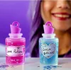 Two potion bottles with glitter and labels, with a smiling person in the background. Náhled obrázku produktu