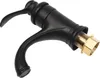 A close-up studio shot of a black faucet with gold fittings against a white background. Podgląd zdjęcia produktu