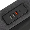 A close-up view of a USB and Type-C charging port panel integrated into a dark gray fabric surface. Produktbild-Vorschau