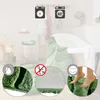 A bathroom scene with a toilet and bathtub, featuring a green rug. Produktbild-Vorschau