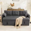 A dark gray sofa with a beige throw blanket is shown in a well-lit room with a wooden cabinet and decorative vases in the background. Podgląd zdjęcia produktu