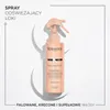 A product shot of a hair spray bottle on a white background with circular elements. Náhled obrázku produktu