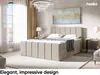 A bedroom scene featuring a king-size boxspring bed with storage, bedside tables, and decor. Produktbild-Vorschau