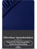 A close-up view of a dark blue microfiber fitted sheet, showing the elasticized edge. Produktbild-Vorschau