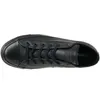 A top-down view of a black leather Converse Chuck Taylor All Star low-top sneaker. Náhled obrázku produktu