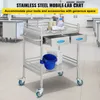 A stainless steel mobile lab cart with two drawers, a shelf, and a blue bucket attached, placed in a laboratory setting. Produktbild-Vorschau