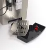 A close-up view of a coffee machine's drip tray and grate, detached from the main unit. Produktbild-Vorschau