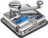 A close-up studio shot of a chrome cigarette rolling machine. Anteprima dell’immagine prodotto