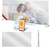 A collage of images showing a modern infrared heater with a mirror finish, a remote control, a smartphone app interface, and a couple interacting with the heater in a living room setting. Produktbild-Vorschau