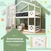 A children's bunk bed with a house-like frame, featuring a chalkboard and a ladder, set against a light green wall with decorative elements. Produktbild-Vorschau