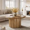 A living room scene with a couch, coffee table, and fireplace. Produktbild-Vorschau