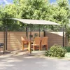 An outdoor dining set with a canopy, set against a wooden fence and lush greenery. Anteprima dell’immagine prodotto