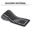 A flexible silicone keyboard is shown bent in half on a white background, with text describing its material properties. Voir les images du produit