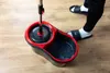 A person is using a spin mop and bucket set on a wooden floor. Produktbild-Vorschau