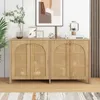 A wooden sideboard with rattan doors is displayed in a room with a plant and artwork. Anteprima dell’immagine prodotto