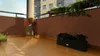 A balcony with a privacy screen and planters. Produktbild-Vorschau