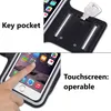 A split image showing a sports armband for a phone. The top shows a key pocket with a key inserted, and the bottom shows a finger interacting with a phone screen inside the armband. Náhled obrázku produktu