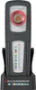 A Scangrip CCT SCAN work light is shown in its charging base. Podgląd zdjęcia produktu