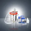 A vacuum pump system with a pressure chamber, a vacuum pump, and a bottle, arranged on a reflective surface against a gradient background. Náhľad obrázku produktu