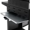 A close-up view of a grill's side shelf and drip tray. Produktbild-Vorschau
