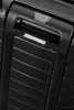 A close-up view of the handle and textured surface of a black suitcase. Produktbild-Vorschau