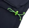 A close-up of a navy blue fleece fabric with a green drawstring and toggle. Náhľad obrázku produktu