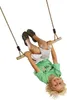 A young boy is upside down on a wooden trapezoid swing. Anteprima dell’immagine prodotto