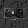 A black stereo system with speakers is shown against a textured black background, with dimensions indicated by white lines and text. Produktbild-Vorschau